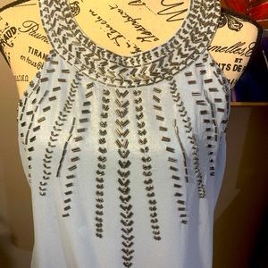 Cache top. Light blue shimmering fabric w/silver